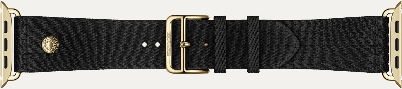 Apple Watch Hermès Series 12 Noir Satin Clou de Selle band detail, smooth black satin webbing with radiant gold hardware